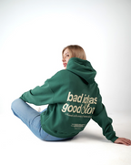 Green hoodie, bold back — ‘Bad Ideas, Good Story