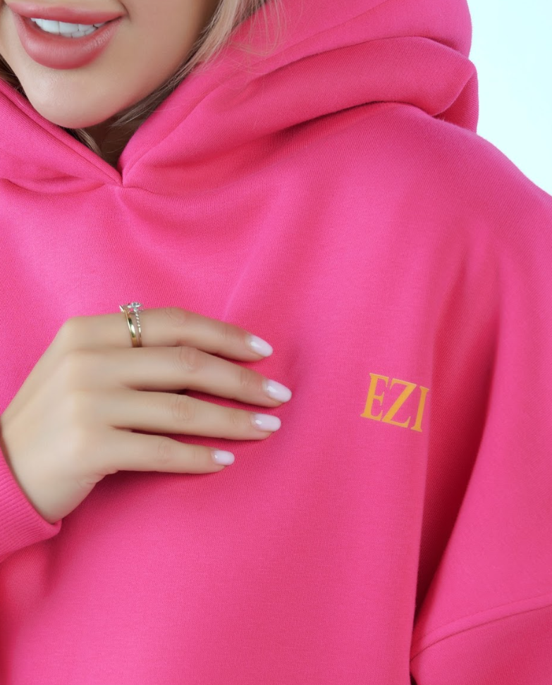 “Front logo, back inspiration — Ezi Fuchsia sweatshirt.”