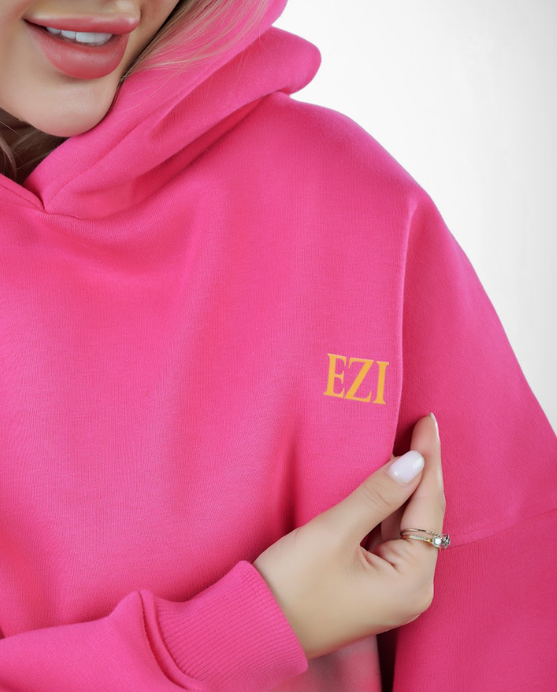 “Front logo, back inspiration — Ezi Fuchsia sweatshirt.”