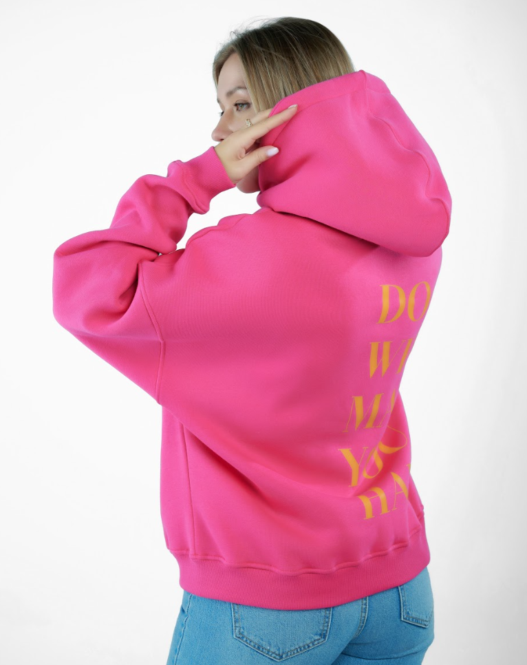 “Front logo, back inspiration — Ezi Fuchsia sweatshirt.”
