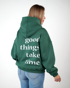 “Front logo, back inspiration — Ezi green sweatshirt.”