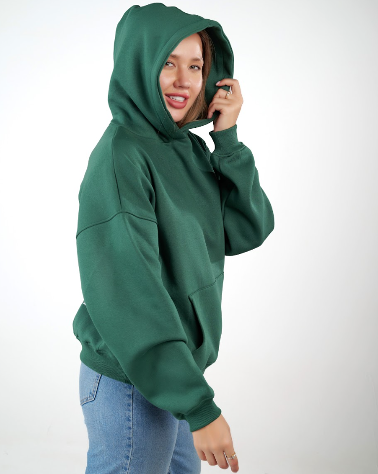 “Front logo, back inspiration — Ezi green sweatshirt.”