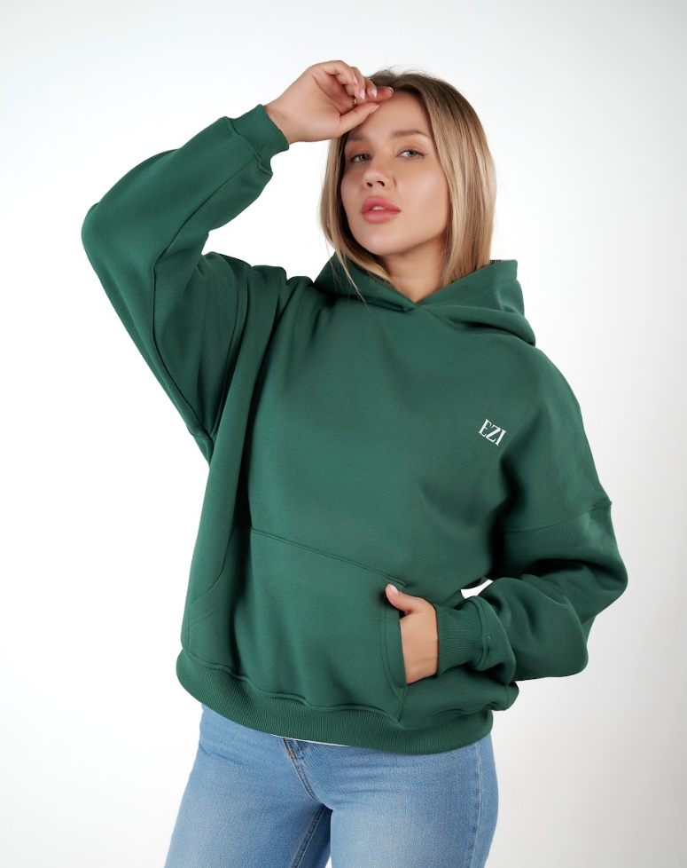 “Front logo, back inspiration — Ezi green sweatshirt.”