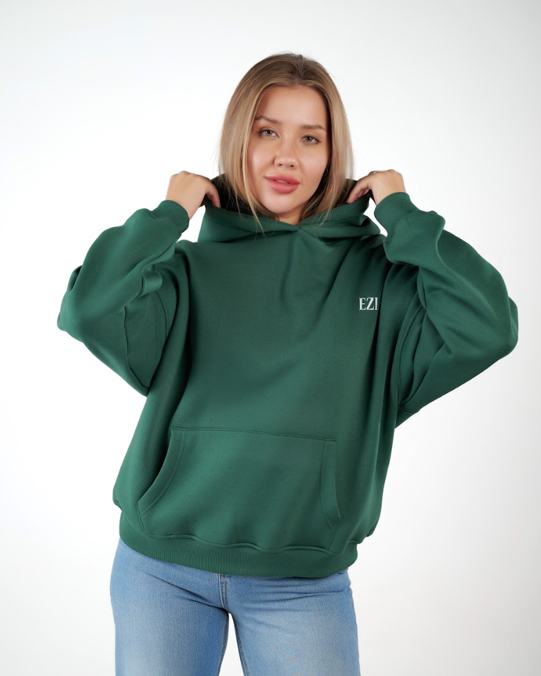 “Front logo, back inspiration — Ezi green sweatshirt.”