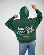 Green hoodie, bold back — ‘Bad Ideas, Good Story