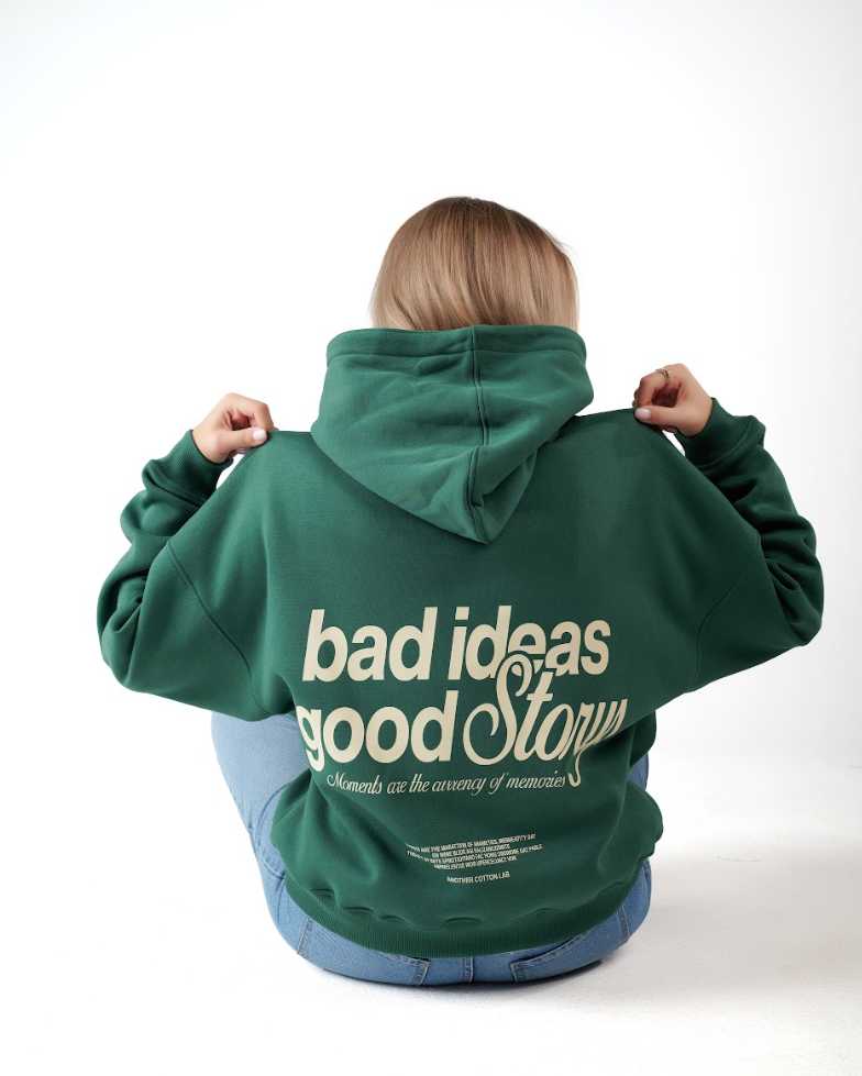 Green hoodie, bold back — ‘Bad Ideas, Good Story
