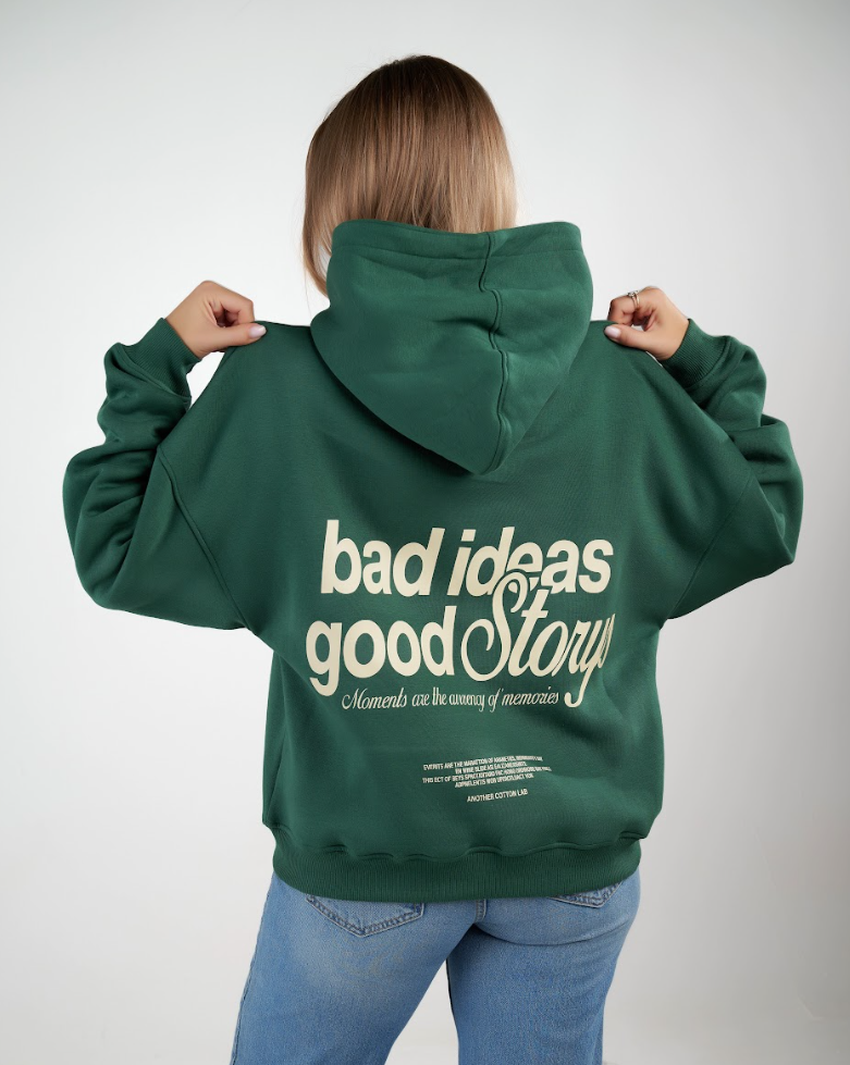 Green hoodie, bold back — ‘Bad Ideas, Good Story