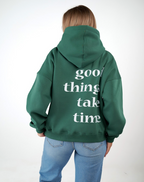 “Front logo, back inspiration — Ezi green sweatshirt.”